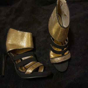 Gold accented black heels